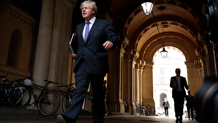 U.K. Prime Minister Boris Johnson walks to his office after a cabinet meeting, London, Sept. 15, 2020.