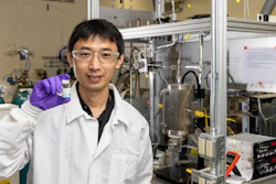 Zhenglong Li, an ORNL scientist in the Energy and Transportation Science Division, holds a sample of a catalyst material used to covert ethanol into butene-rich mixed olefins.