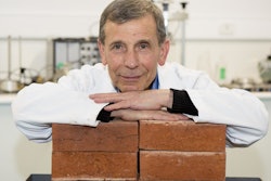 Lead researcher Associate Professor Abbas Mohajerani with bricks made with cigarette butts.