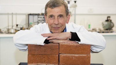 Lead researcher Associate Professor Abbas Mohajerani with bricks made with cigarette butts.