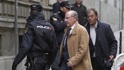 Former IMF managing director Rodrigo Rato arrives at the National Court in Madrid, Dec. 20, 2012.