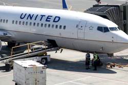 A United Airlines commercial jet sits at a gate at Terminal C of Newark Liberty International Airport, Newark, N.J., July 18, 2018.