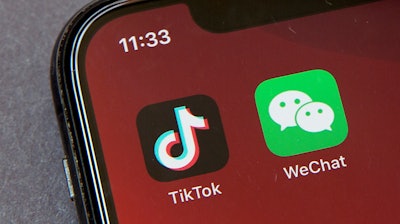 TikTok and WeChat icons on a smartphone screen, Beijing, Aug. 7, 2020.