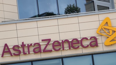 AstraZeneca offices and the corporate logo in Cambridge, England.