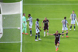 Leicester City's Timothy Castagne, bottom, celebrates after scoring against West Bromwich Albion at the Hawthorns, West Bromwich, England, Sept.13, 2020.