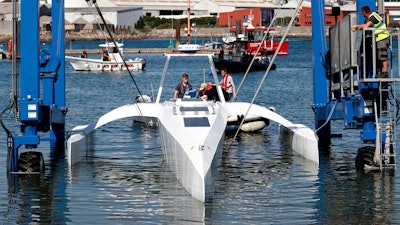 Technicians check the hull and interior of the Mayflower Autonomous Ship, Plymouth, U.K., Sept. 14, 2020.