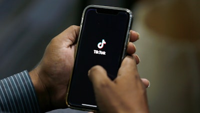 A man opens the TikTok app on his cell phone, Islamabad, Pakistan, July 21, 2020.