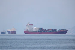A cargo ship approaches the port of Piraeus near Athens, Greece, May 26, 2020.
