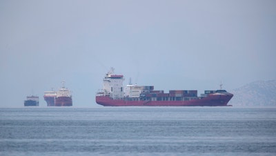 A cargo ship approaches the port of Piraeus near Athens, Greece, May 26, 2020.