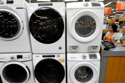 Clothes dryers are stacked on top of washing machines at a Home Depot in Boston.
