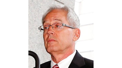 Former Nissan Motor Co.'s executive Greg Kelly arrives at a district court in Tokyo, on June 24, 2019. Kelly's trial in Tokyo District Court opens Sept. 15, nearly two years after his arrest, and the same day he turns 64 . If convicted of charges related to alleged under-reporting of former chairman Carlos Ghosn's income, Kelly could face up to a decade in prison.