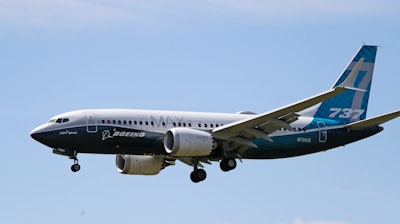 A Boeing 737 Max jet heads to a landing at Boeing Field following a test flight in Seattle, June 29, 2020.