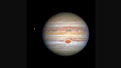 An Aug. 25, 2020, image captured by NASA's Hubble Space Telescope shows Jupiter and one of its moons, Europa, at left.