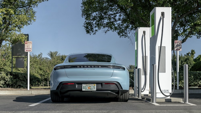 A 2020 Porsche Taycan at a public charging station.