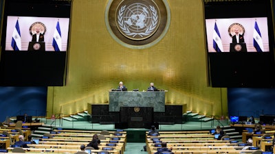 Nayib Armando Bukele, president of El Salvador, is shown on video monitors as he speaks in a pre-recorded video message during the 75th session of the United Nations General Assembly, Sept. 29, 2020.