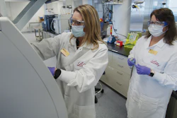 Researchers prepare cells to produce possible COVID-19 antibodies for testing in a laboratory in Indianapolis, May 2020.