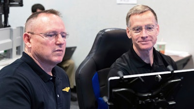 Butch Wilmore, left, and Chris Ferguson participate in a flight control simulation for a Boeing CST-100 Starliner capsule at the Johnson Space Center in Houston, Nov. 29, 2018.