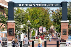 Pedestrians walk along the downtown mall area in the Old Town.