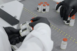 An undated image from video provided by Regeneron Pharmaceuticals shows vials inspected at the company's facilities in New York state, Oct. 2, 2020.