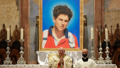 An image of Carlo Acutis shown during his beatification ceremony, celebrated by Cardinal Agostino Vallini, in the St. Francis Basilica, Assisi, Italy, Oct. 10, 2020.