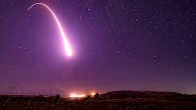 This image taken with a slow shutter speed on Oct. 2, 2019, and provided by the U.S. Air Force shows an unarmed Minuteman 3 intercontinental ballistic missile test launch at Vandenberg Air Force Base, Calif. The Pentagon has raised to $95.8 billion the estimated cost of fielding a new fleet of land-based nuclear missiles to replace the Minuteman 3.