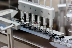 Rubber stoppers are placed onto filled vials of the investigational drug remdesivir at a Gilead U.S. manufacturing site, March 2020.