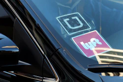 Ride-share car displaying Lyft and Uber stickers, Los Angeles, Jan. 12, 2016.