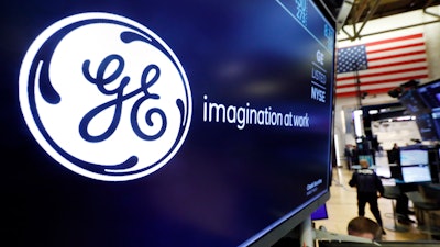 General Electric logo appears above a trading post on the floor of the New York Stock Exchange, Aug. 16, 2019.