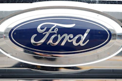 In this Oct. 20, 2019, file photograph, the company logo shines off the grille of an unsold 2019 F-250 pickup truck at a Ford dealership in Littleton, Colo. Ford Motor Co. posted a stronger-than-expected third-quarter net profit, the company announced Wednesday, Oct. 28, 2020, as demand for cars and trucks recovered from coronavirus shutdowns and the company sold more high-margin trucks.