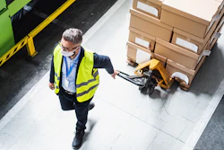 Top View Of Man Worker With Protective Mask Working In Industrial Factory Or Warehouse 1238008812 8256x5168 (1)