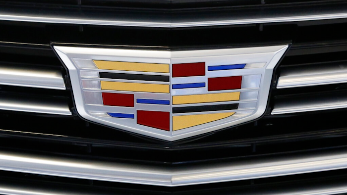 This Thursday, Feb. 11, 2016, file photo shows the Cadillac logo, a General Motors Co. brand, on display on a vehicle at the Pittsburgh International Auto Show in Pittsburgh. The U.S. government’s road safety agency on Wednesday, Nov. 11, 2020, is investigating complaints that the rear suspensions on older Cadillac SUVs can fail, causing drivers to lose control and possibly crash. The probe by the National Highway Traffic Safety Administration covers about 344,000 SUVs from 2010 through 2015.
