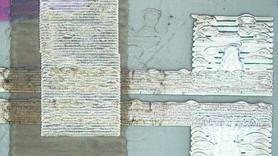 Optical microscopy image of a field effect transistor containing an inkjet printed graphene channel.