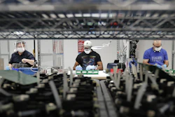Line workers put together ventilators at the Ford Rawsonville plant in Ypsilanti Township, Mich., May 13, 2020.