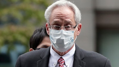 Former Nissan Motor Co. executive Greg Kelly arrives for the first trial hearing at the Tokyo District Court, Sept. 15, 2020.