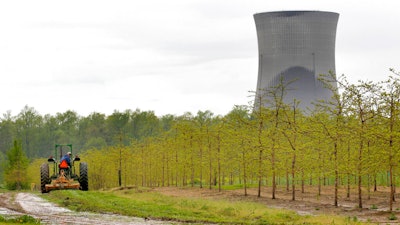 A worker is seen in the area surrounding a tree farm in North Perry, Ohio.