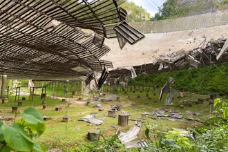 A 100-foot gash, created by a broken cable and metal platform, in the radio telescope's reflector dish in Arecibo, Puerto Rico, Aug. 11, 2020.