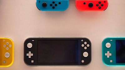 Nintendo Switch game consoles on display at Nintendo's official store in Tokyo, Jan. 23, 2020.