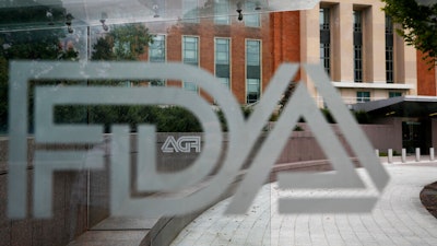 U.S. Food and Drug Administration building behind FDA logos.