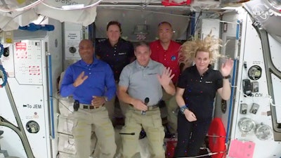 From left to right: pilot Victor Glover, mission specialist Shannon Walker, Crew Dragon commander Michael Hopkins, JAXA astronaut and mission specialist Soichi Noguchi and flight engineer Kate Rubins hold a news conference aboard the International Space Station, Nov. 19, 2020.