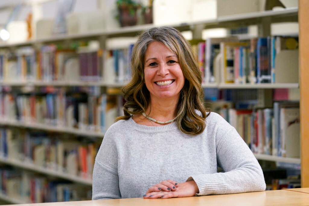 Middle school counselor Sam Baker in the school's library in Sammamish, Wash., Nov. 18, 2020.