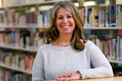 Middle school counselor Sam Baker in the school's library in Sammamish, Wash., Nov. 18, 2020.