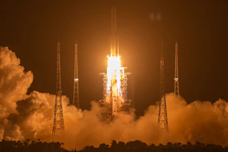 A Long March-5 rocket carrying the Chang'e 5 lunar mission lifts off at the Wenchang Space Launch Center, Nov. 24, 2020.