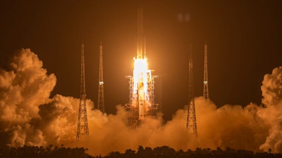 A Long March-5 rocket carrying the Chang'e 5 lunar mission lifts off at the Wenchang Space Launch Center, Nov. 24, 2020.