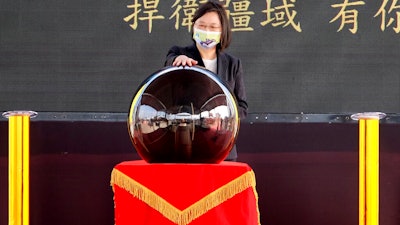 Taiwan's President Tsai Ing-wen touches a ceremonial orb to inaugurate the production of domestically-made submarines at CSBC Corp's shipyards, Kaohsiung, Nov. 24, 2020.