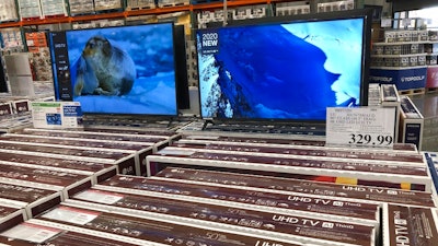 Rows of boxed big-screen televisions sit on display at a Costco warehouse in this photograph taken Wednesday, Nov. 18, 2020, in Sheridan, Colo. Orders for big-ticket manufactured goods slow to modest gain of 1.3% in October indicating economy is slowing.