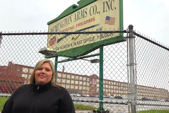 Jacquie Sweeney stands outside the Remington firearms factory in Ilion, N.Y., Oct. 20, 2020.