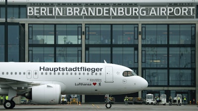 Lufthansa airplane parked in front of Terminal 1 after its arrival at the new Berlin-Brandenburg-Airport 'Willy Brandt' in Berlin, Oct. 31, 2020.