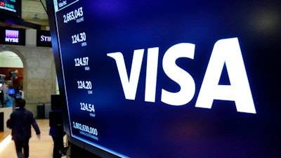 The Visa logo above a trading post on the floor of the New York Stock Exchange, April 23, 2018.