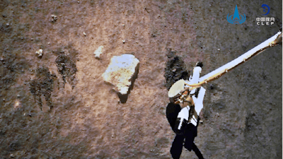 The Chang'e-5 probe gathering samples on the moon surface, Dec. 2, 2020.