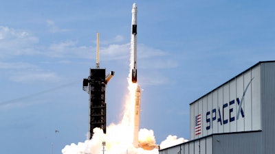 A SpaceX Falcon 9, with NASA astronauts Doug Hurley and Bob Behnken in the Dragon crew capsule, lifts off from Pad 39-A at Kennedy Space Center, Cape Canaveral, Fla., May 30, 2020.